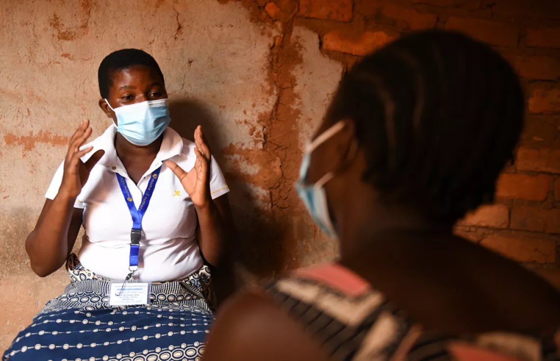 UNICEF Malawi/2021/Chikondi Mentor mother Awema on duty, showing teen mother Florence that “it can be done, I did it”